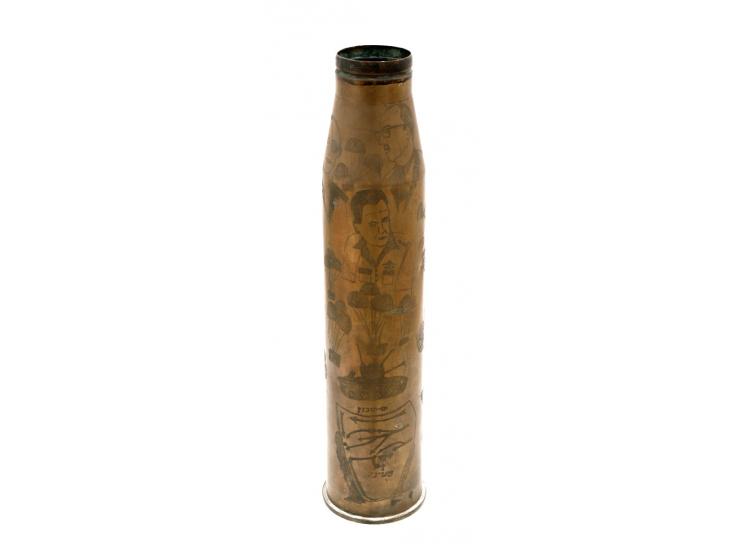 A large shell case, decorated with Six-Day War scenes. [1967]. Engraved brass. An Isaeliana folk work by a soldier, depicting