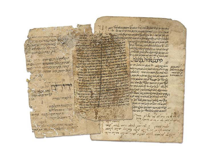 A varied collection of handwritten leaves and leaf remnants, printed leaves with glosses and title pages with signatures. 
&m
