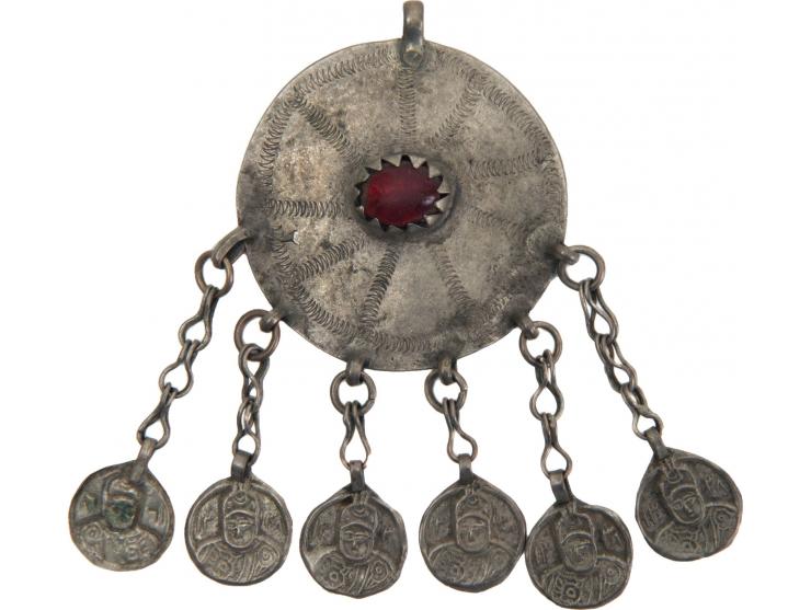 Two necklaces and a pendant. [Central Asia, early 20th century].
 1. Necklace with a large silver pendant with two loops and 